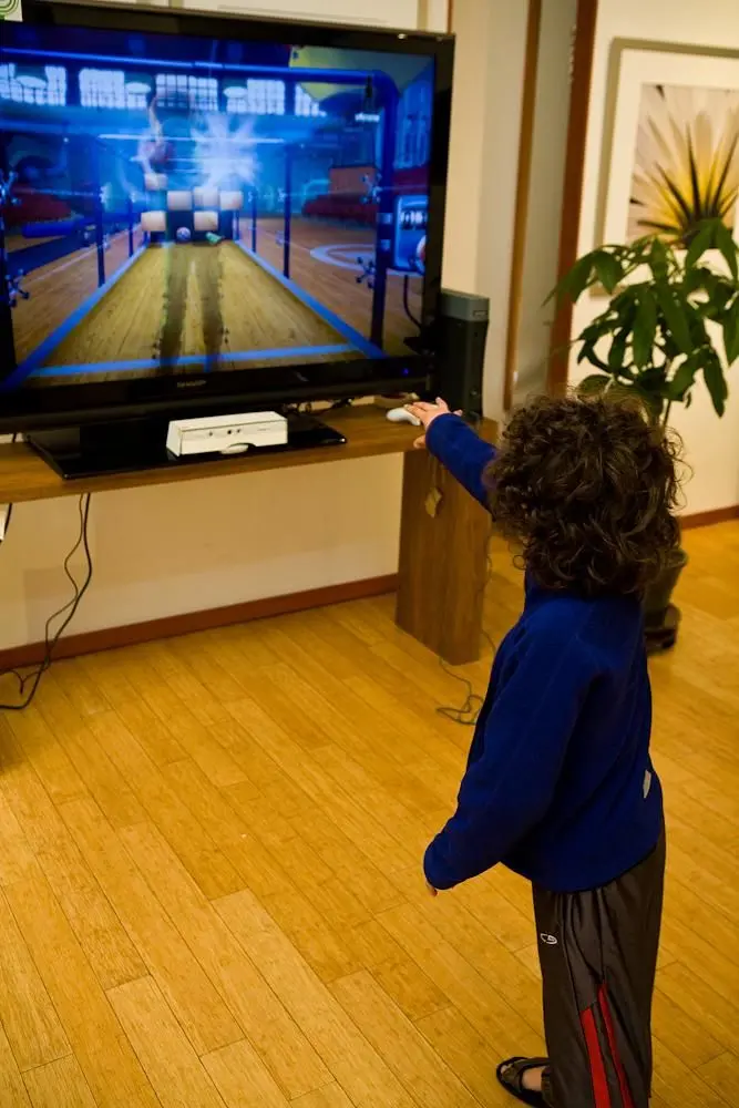 Microsoft release off-screen shots of kids and adults playing Natal