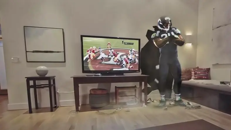 Microsoft shares vision of sports-viewing through Hololens, letting NFL players burst through your walls